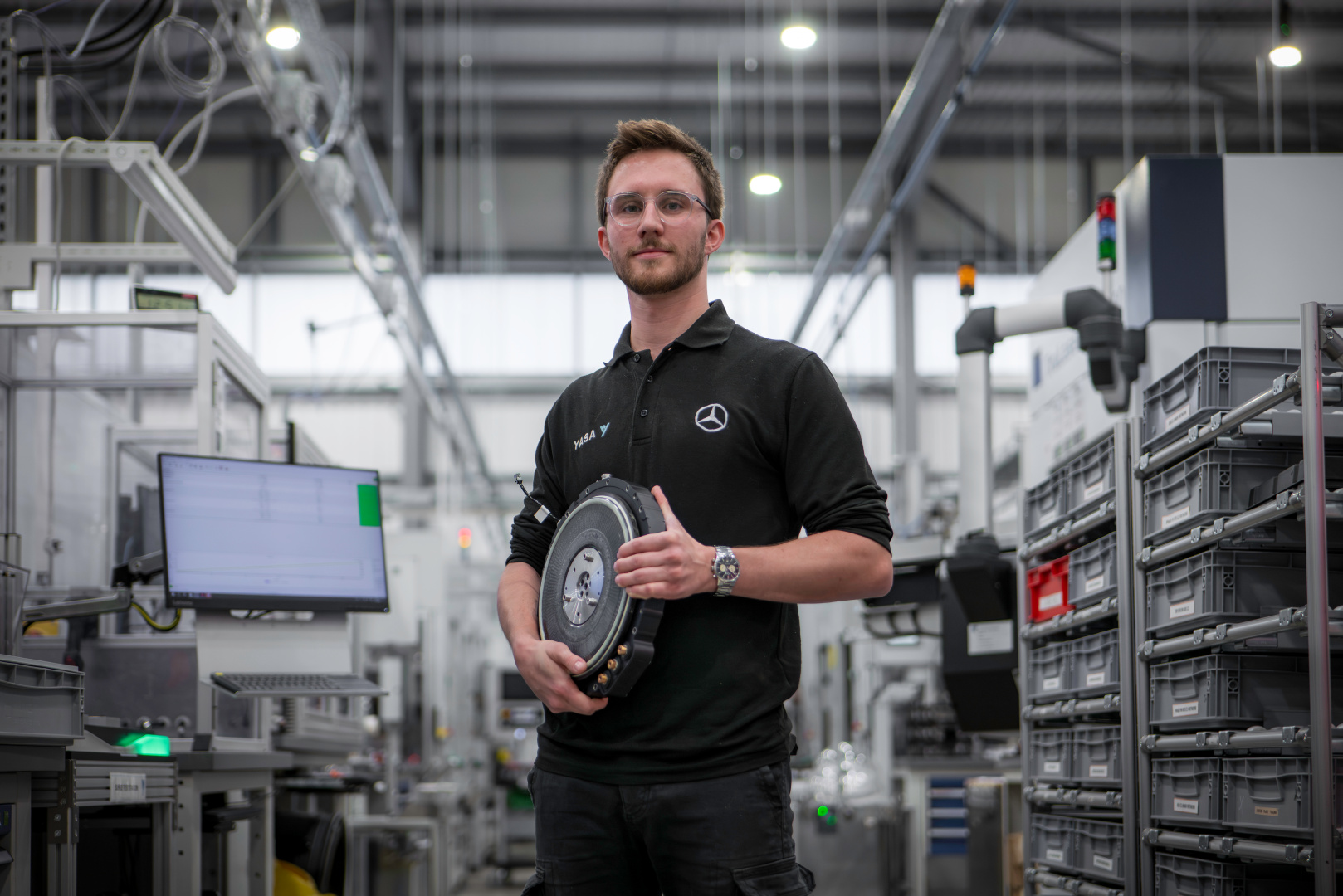 SMALL_5_YASA R&D Engineer Eddie Martin holds new 12.7kg prototype motor_